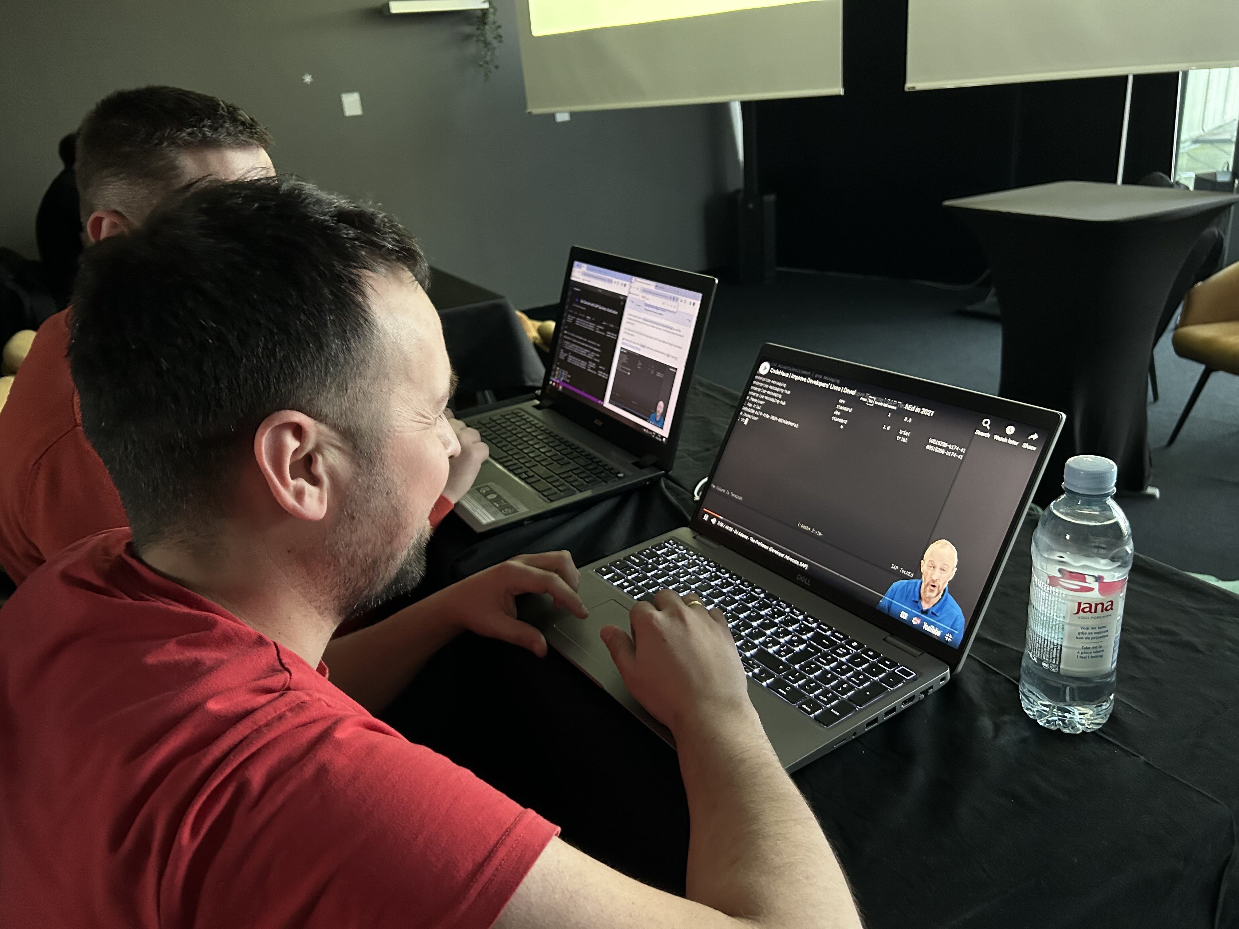 Attendee watching a YT video to understand more about the btp CLI